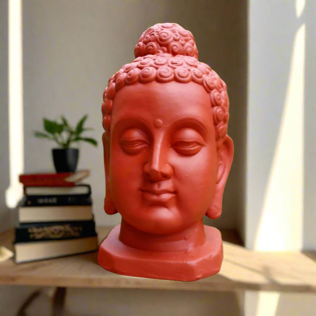 Terracotta Buddha Face in garden 