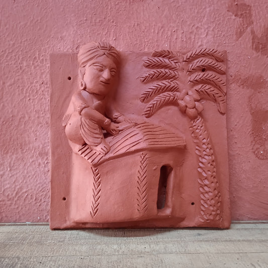 Terracotta Man making a roof