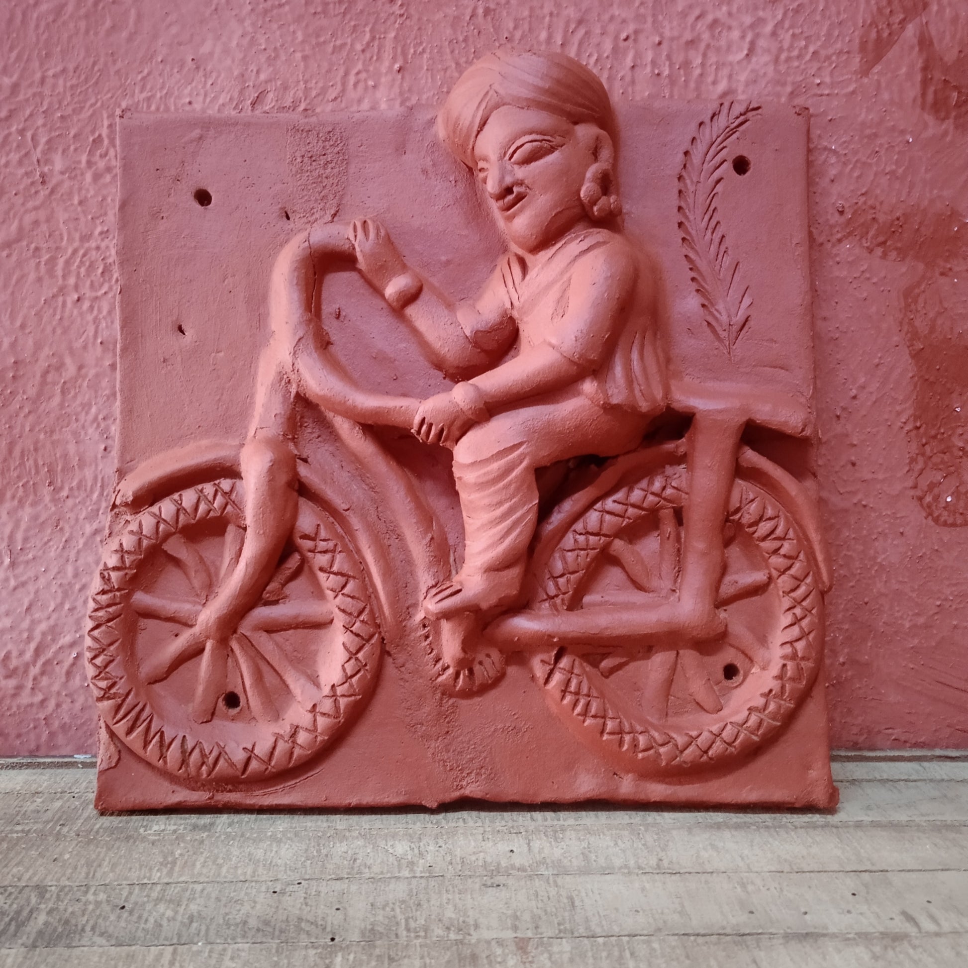 Terracotta Man on bicycle