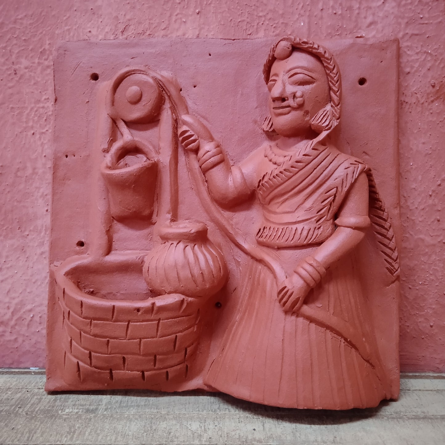 Terracotta woman at a well