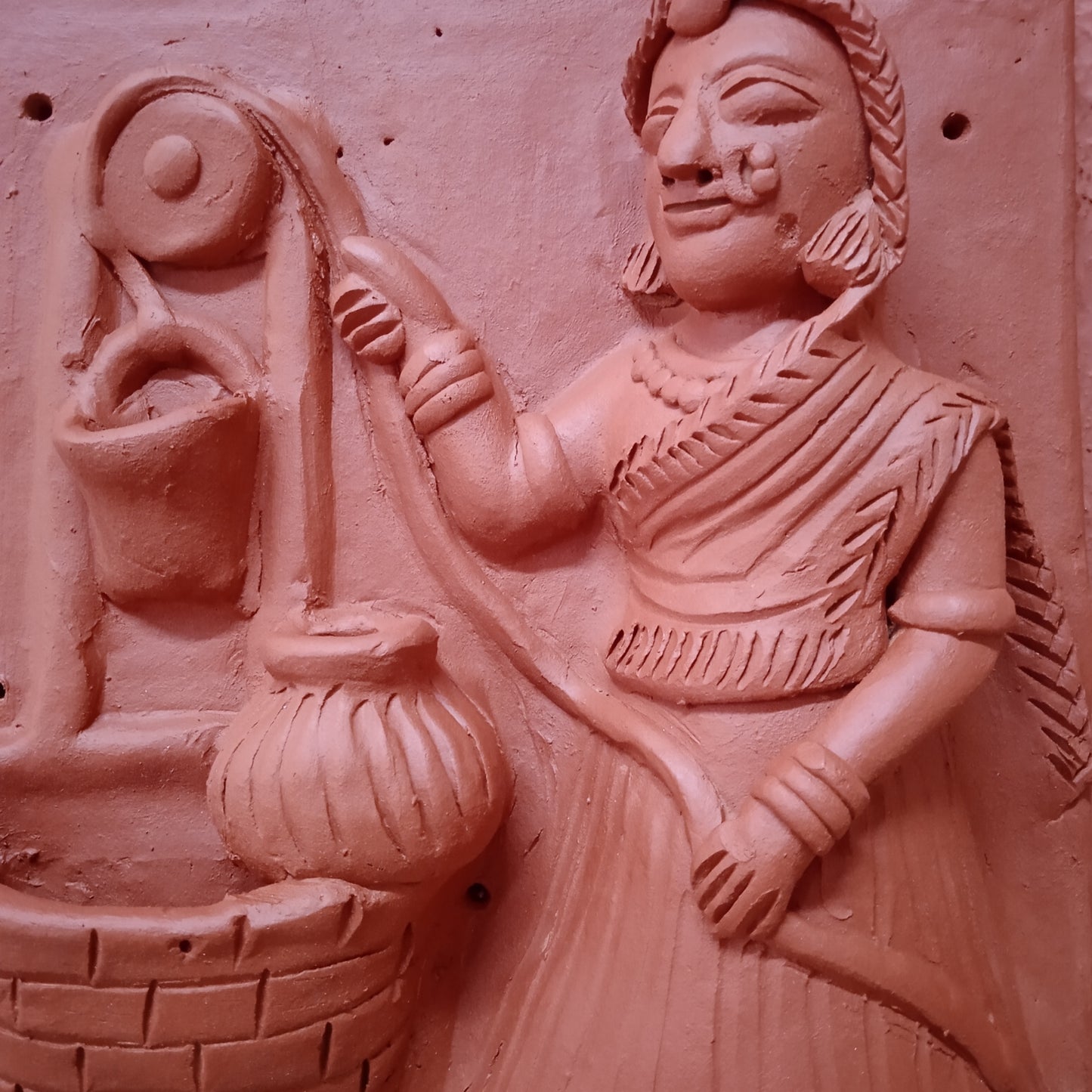 Terracotta woman at a well